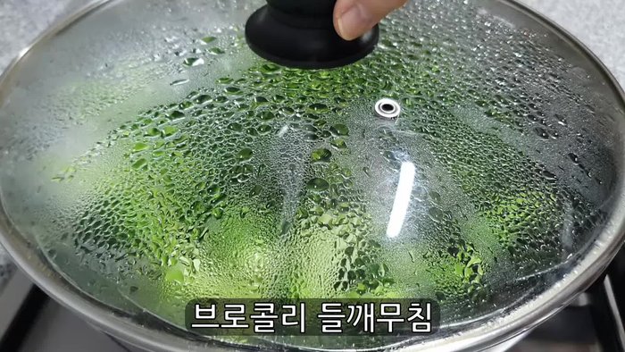 Wash and cut broccoli into bite-sized pieces. (Note: There is no specific timestamp for this step in the provided transcript.)