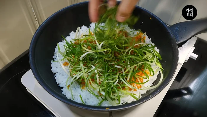 Generously layer the cooked pork belly on top.