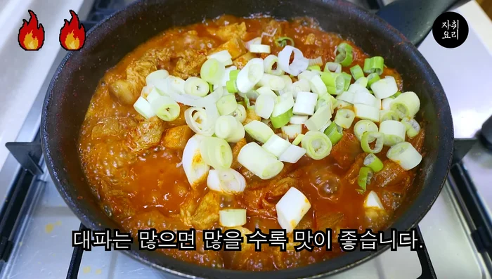 Add finely chopped green onions and sesame seeds.