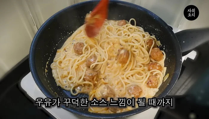 Add the pre-boiled pasta noodles to the sauce. Stir until the milk forms a thick sauce. Add Mozart cheese for extra thickness.