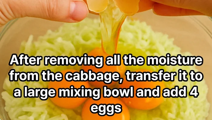 Place the drained cabbage in a large bowl and crack the eggs into it.