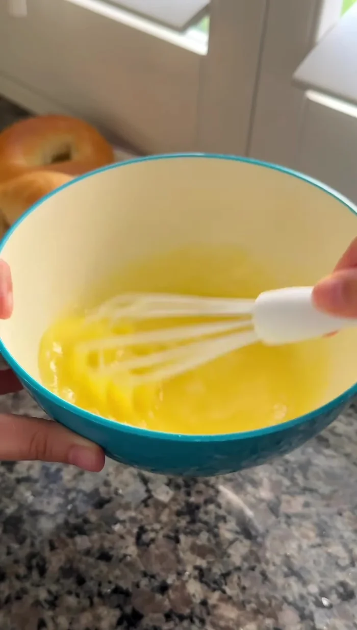 Combine melted butter, egg, and whisk until emulsified. Stream in milk and add minced garlic, sugar, garlic powder, onion powder, and dried parsley. Whisk together.