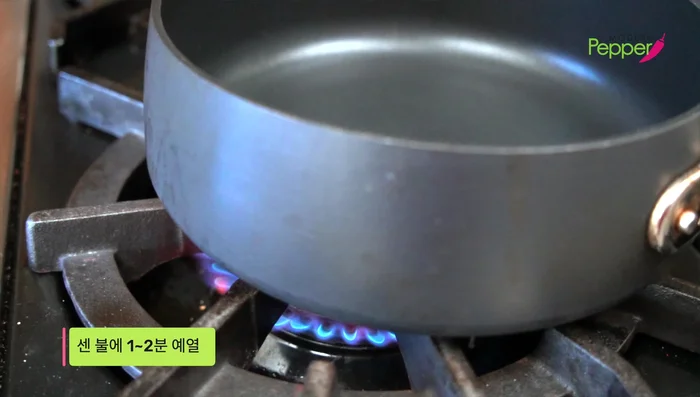 Heat the pan: Heat a pan over high heat for about a minute. Add oil.