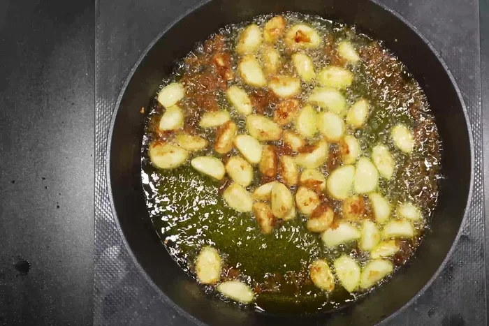 Boil until garlic is golden brown.