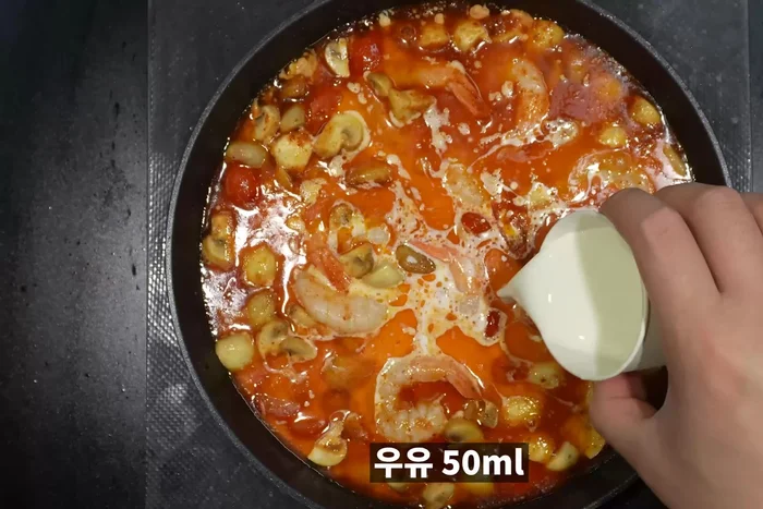 Add whipped cream (or fresh cream), milk, and mozzarella cheese. Boil.