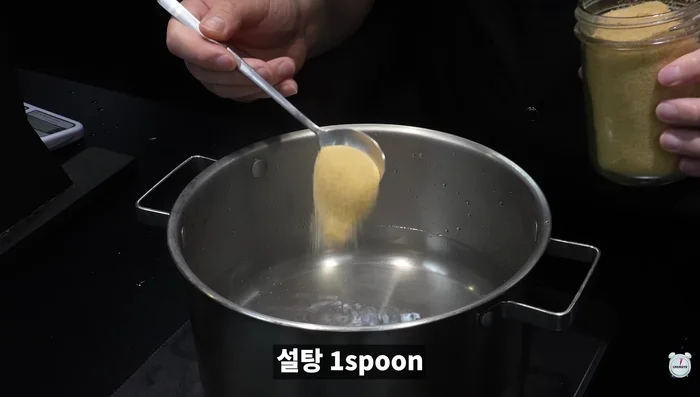 Boil pork ribs in water and sugar for exactly 10 minutes.