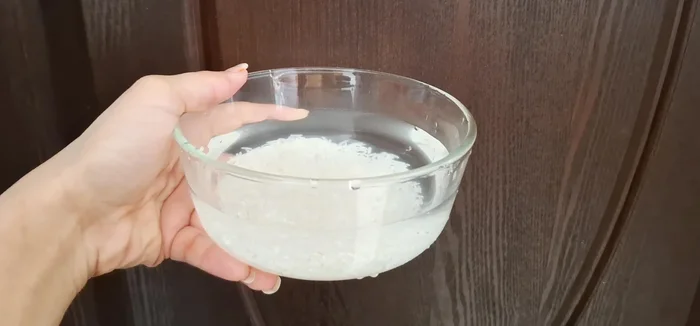 Wash 4 tablespoons of rice (brown or white) thoroughly 5-6 times until the water runs clear. This removes any dust or smell.