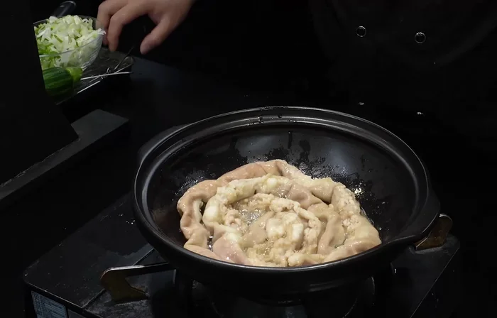 Cut the fried tripe into small pieces and set aside in a bowl.