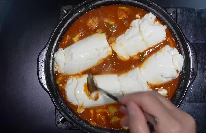 Simmer over low heat until the onion is cooked.