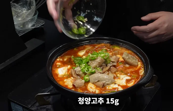 Place the reserved tripe on top of the stew.