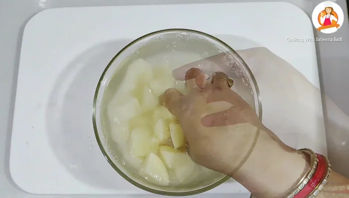 Wash the chopped potatoes thoroughly two to three times.