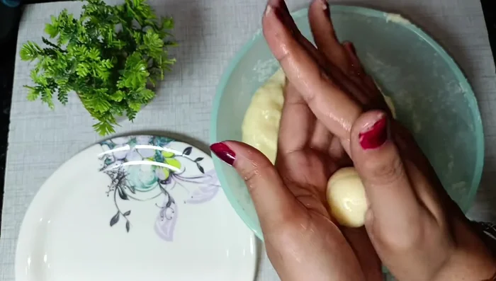 Roll the dough into small balls. Using a bottle cap, press gently into the center of each ball to create a mushroom shape.