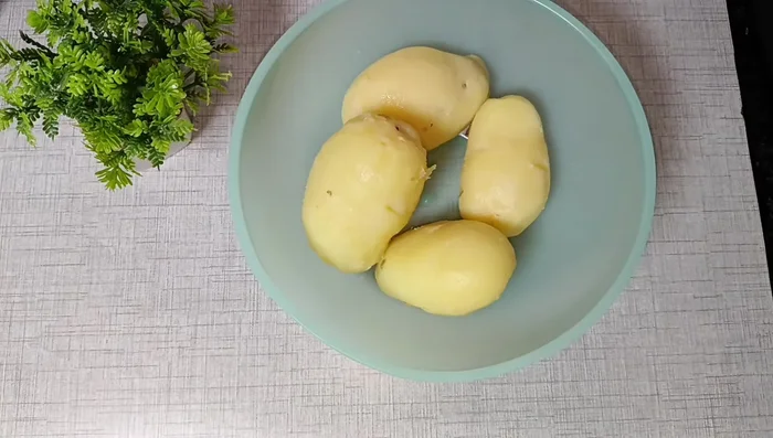 Boil four large potatoes until tender. Mash them thoroughly until completely smooth.