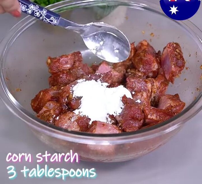 Add 3 tablespoons of cornstarch and mix until the ribs are coated.