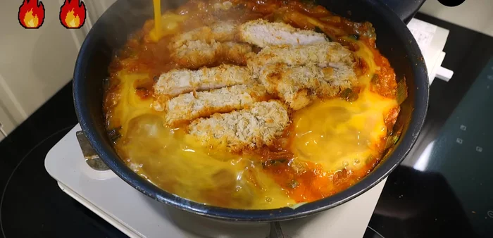 Pour egg water around the edges, cover, and wait until the eggs are cooked.