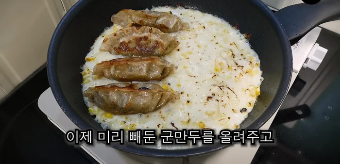 Place the previously fried dumplings on top of the cheese mixture.