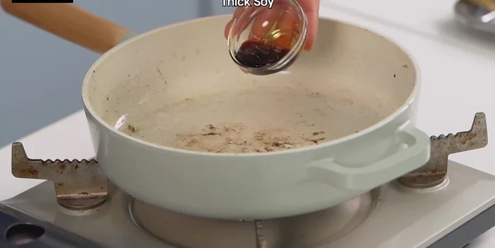 Prepare the sauce: In a separate pan, combine soy sauce, sugar, and a little water. Simmer until slightly caramelized. Add ketchup (or vinegar) to taste.