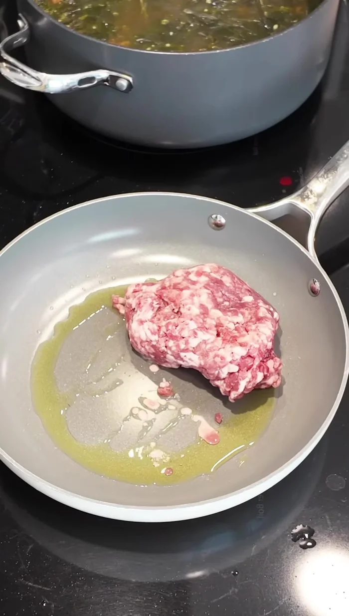 In a hot pan with avocado oil, cook the ground pork until fully cooked.
