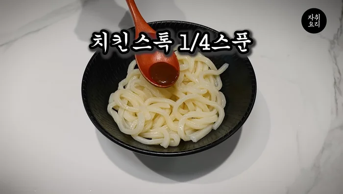 Add a small amount of chicken filling (if using), a spoonful of sesame oil, and mix well.