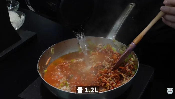 Pour in water, add anchovy sauce and beef broth.