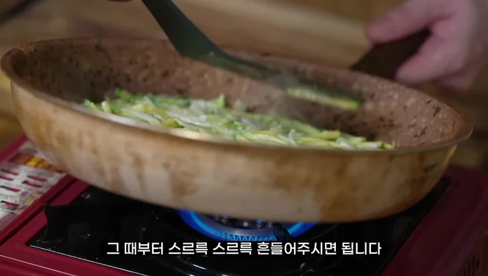 Cook until the bottom is lightly browned. Gently shake the pan to loosen the pancake before flipping.