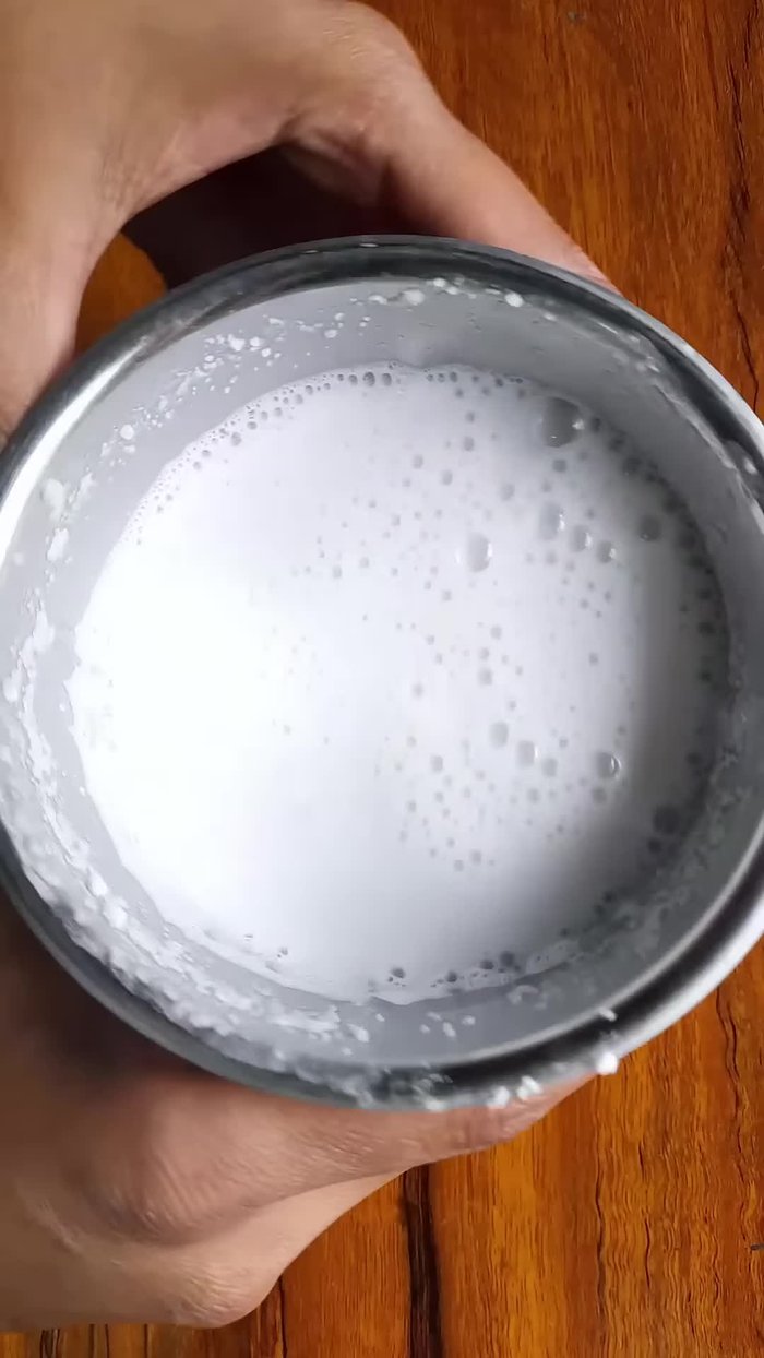 Grind the soaked rice in a mixer jar.