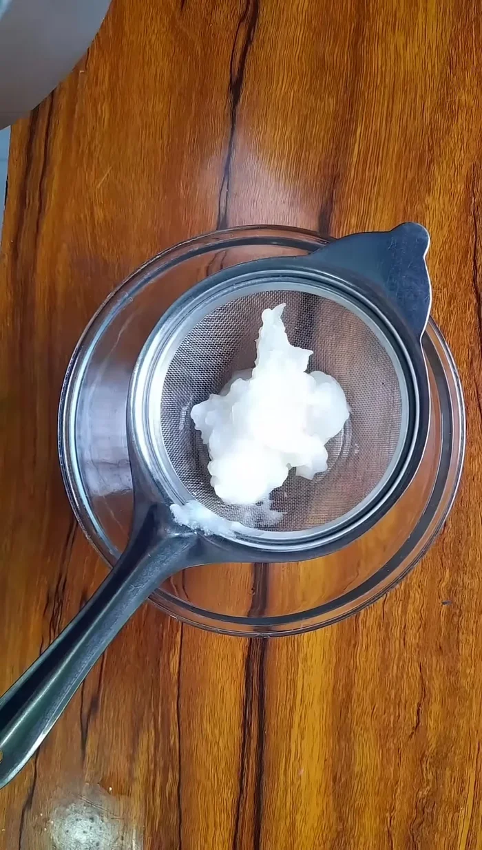 Filter the potato and rice mixture through a tea strainer into a bowl.
