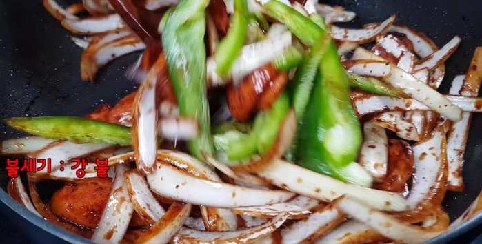 Add the bell peppers and stir-fry for about 1 minute.