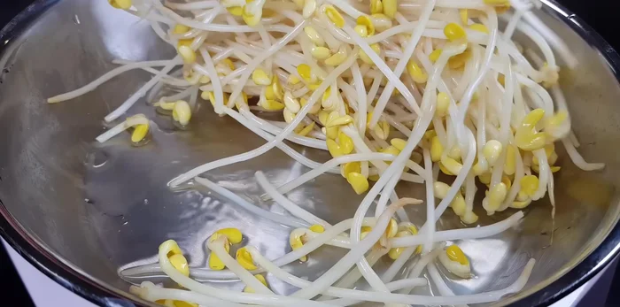 After 3 minutes, turn off the heat and transfer the bean sprouts to a mixing bowl.