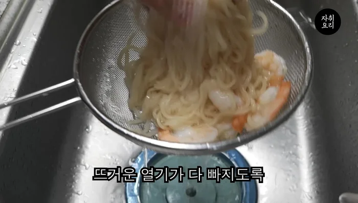Combine cooked noodles, cold noodle broth, peanut sauce, cucumber, shrimp, seaweed egg (optional), and ice.