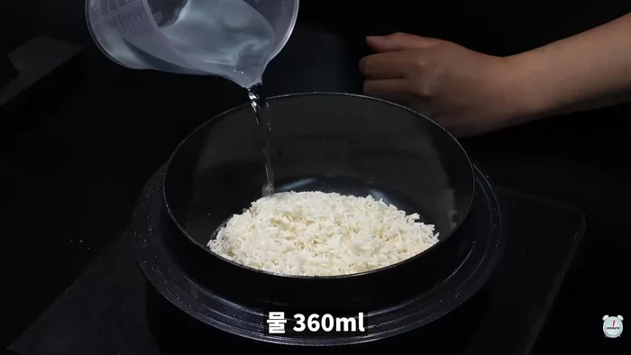 Cook rice with water. Annammi (optional) can be added for enhanced flavor.