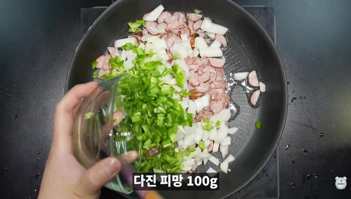 Add chopped green onions and minced garlic, stir-fry until pork is cooked.