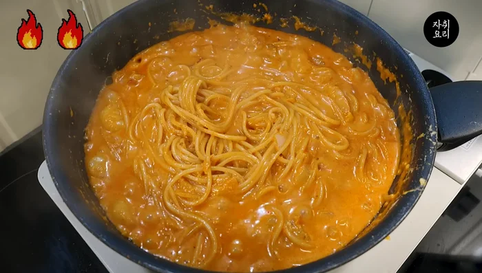 Remove noodles and roughly shape with chopsticks.