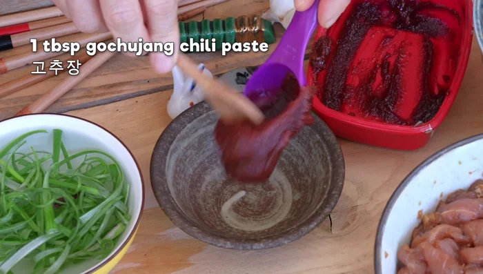 Prepare dipping sauce with gochujang, rice syrup/honey, and sesame oil.