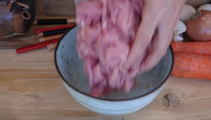 Cut pork into 0.2in thick slices. Marinate with soy sauce, dark soy sauce, cooking sake, salt, sugar, pepper, sesame oil, and garlic.