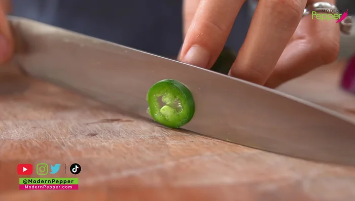Prepare toppings: Thinly slice jalapeno (remove seeds if desired) and red onion. Set aside.
