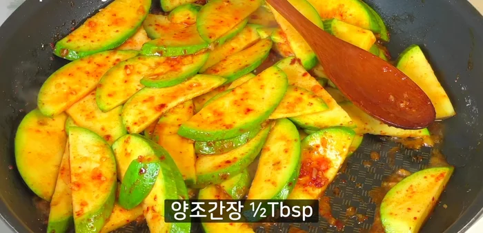 Add the pickled pumpkin and onions. Stir-fry until heated through.