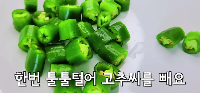 Prepare the green onions by slicing them.