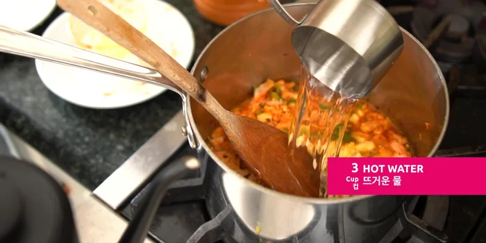 Add 3 cups of hot water, bring to a boil. Once boiling, add the ramen soup packets and noodles. Cover halfway and cook on high heat for 1.5 minutes.