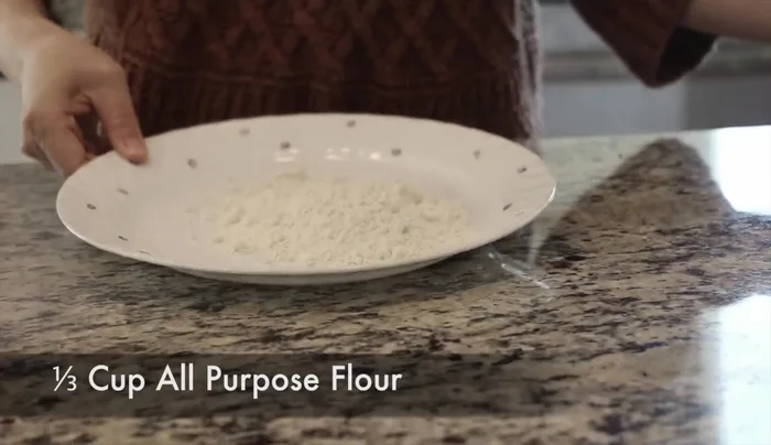 Place all-purpose flour on a flat dish. Coat both sides of each lotus root slice with flour.