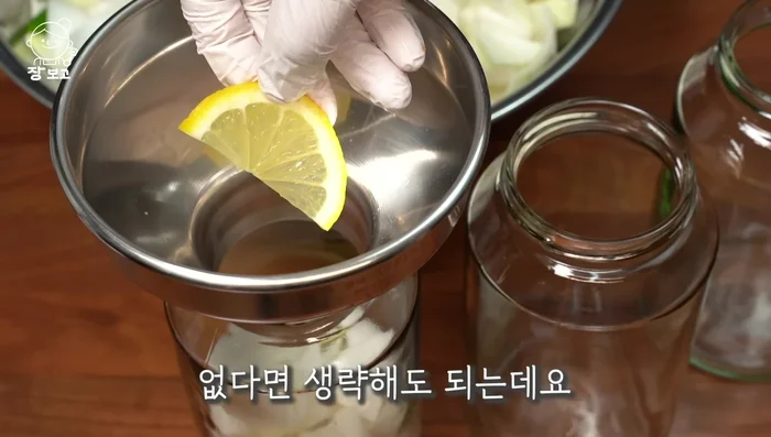 If using, slice a lemon and add it to the bowl. (Lemon enhances onion absorption and adds flavor.)