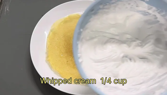 In a separate bowl, combine whipped cream and sugar. Beat until stiff peaks form.