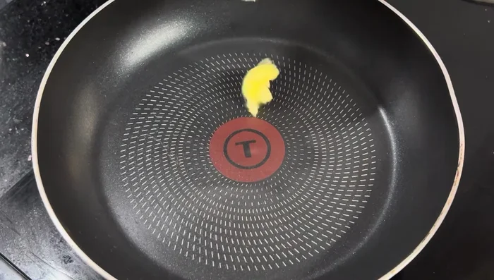 Heat a frying pan. Add butter and spread evenly. (For the first pancake, you can skip the butter).
