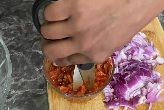 Chop kimchi into smaller pieces.