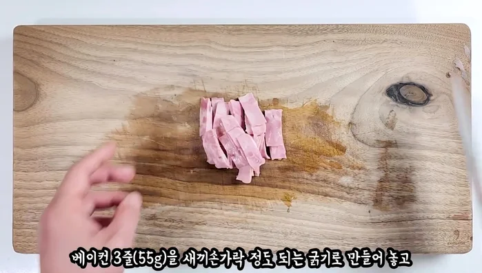 Cut bacon into small pieces.