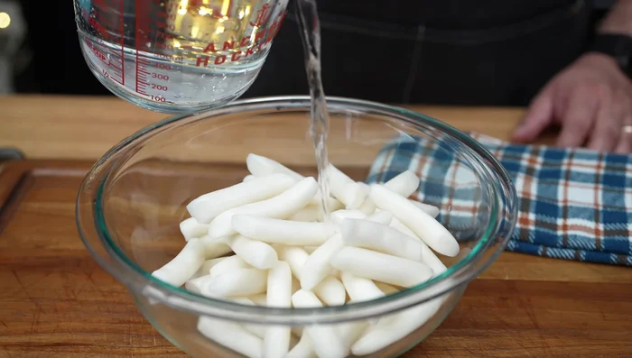 If using refrigerated rice cakes, soak them in warm water for 10-15 minutes.