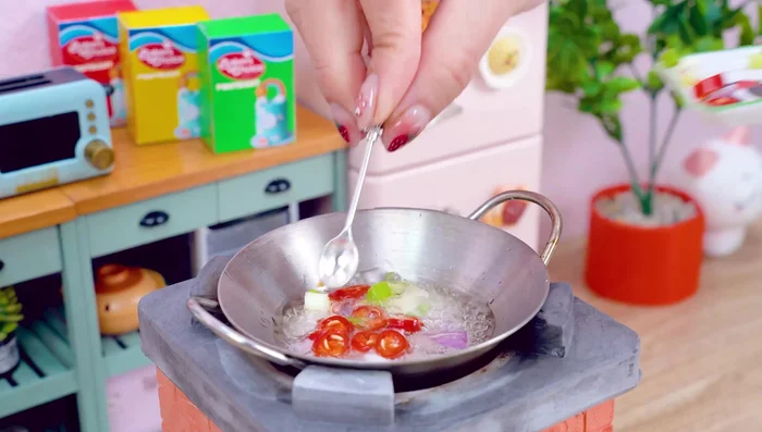 Add cooking oil to the pan. Add the vegetable mixture to the pan. Stir well. Add the octopus to the pan. Add the sauce mixture. Mix well.