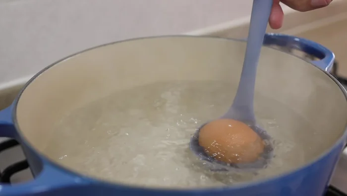 Cook the eggs: Boil 8 cups of water, add 12 eggs, and cook on gentle heat for 7 minutes. Stir gently with a ladle.