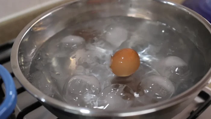 Shock the cooked eggs in ice water to make peeling easier.