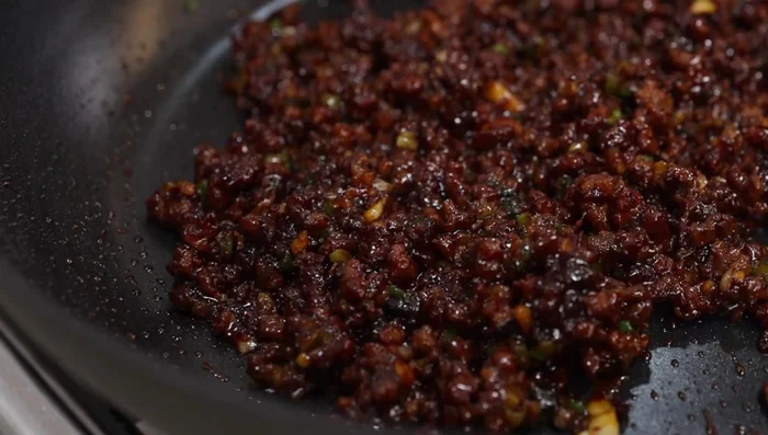 Add 2 cups of water to the pan, stir, and bring to a boil. Reduce heat to medium-high.